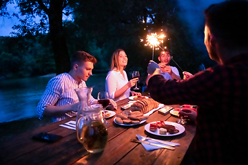 Image showing happy friends having french dinner party outdoor