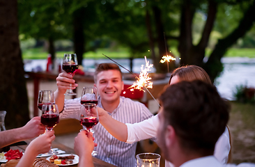 Image showing happy friends having french dinner party outdoor