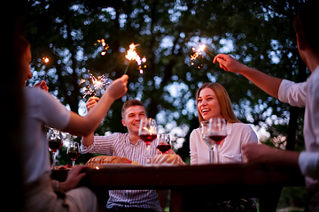 Image showing happy friends having french dinner party outdoor