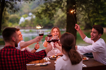 Image showing happy friends having french dinner party outdoor