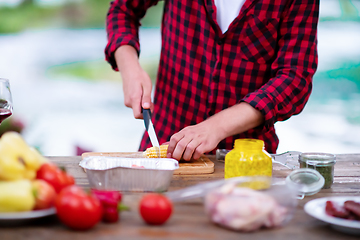 Image showing Man cutting vegetables for salad or barbecue grill