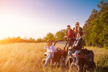 Image showing group of young people driving a off road buggy car