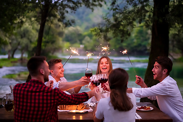 Image showing happy friends having french dinner party outdoor