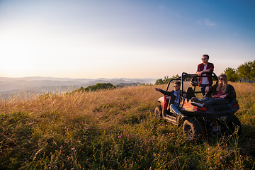 Image showing group of young people driving a off road buggy car