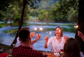 Image showing happy friends having french dinner party outdoor