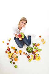 Image showing Fruits and blond cute woman