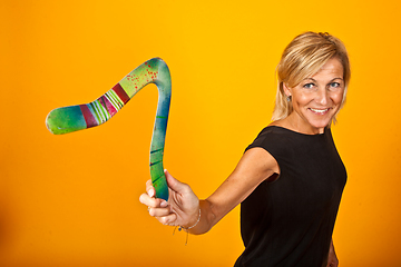 Image showing woman posing with a boomerang