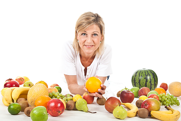 Image showing Fruits and blond cute woman