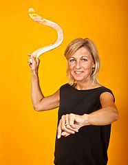 Image showing woman posing with a boomerang