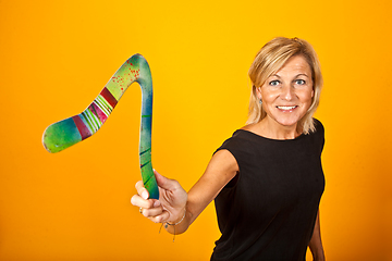 Image showing woman posing with a boomerang