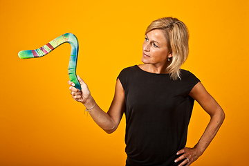 Image showing woman posing with a boomerang