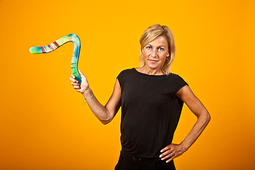 Image showing woman posing with a boomerang