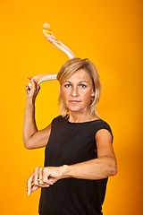 Image showing woman posing with a boomerang