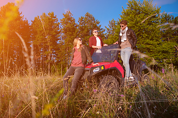 Image showing group of young people driving a off road buggy car