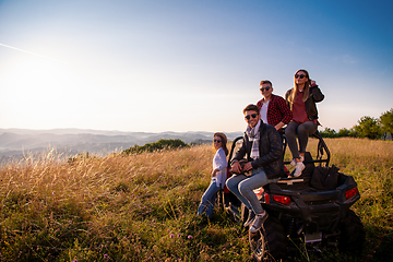 Image showing group of young people driving a off road buggy car