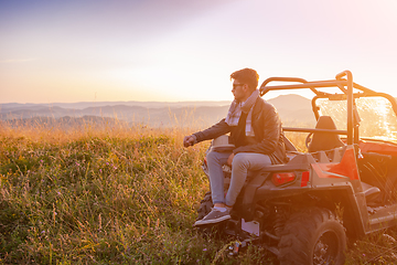 Image showing portrait of young man driving a off road buggy car