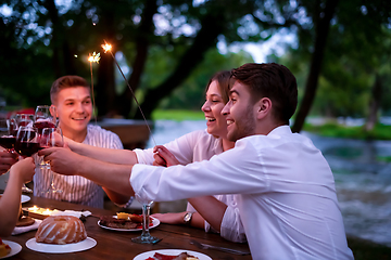 Image showing happy friends having french dinner party outdoor