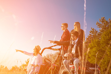 Image showing group of young people driving a off road buggy car