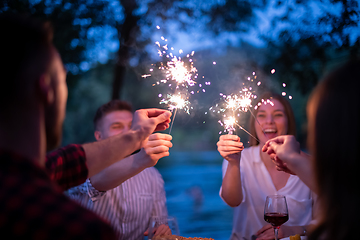 Image showing happy friends having french dinner party outdoor