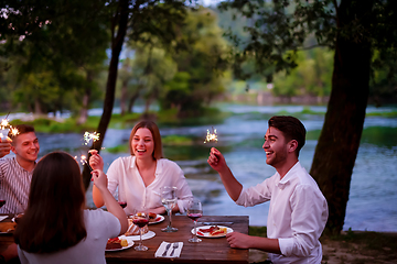 Image showing happy friends having french dinner party outdoor