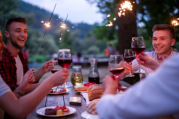 Image showing happy friends having french dinner party outdoor