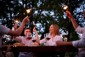 Image showing happy friends having french dinner party outdoor