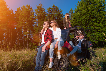 Image showing group of young people driving a off road buggy car