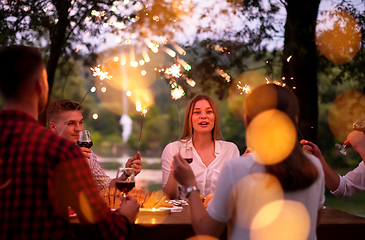 Image showing happy friends having french dinner party outdoor