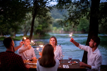 Image showing happy friends having french dinner party outdoor