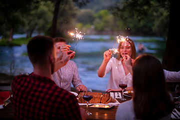 Image showing happy friends having french dinner party outdoor