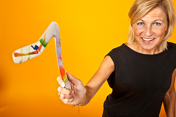 Image showing woman posing with a boomerang