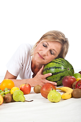 Image showing Fruits and blond cute woman