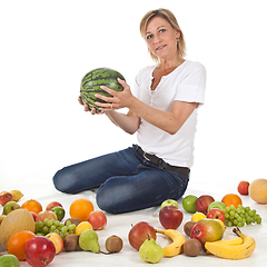 Image showing Fruits and blond cute woman