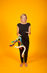 Image showing woman posing with a boomerang