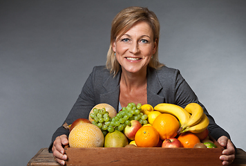 Image showing Fruits and blond cute woman