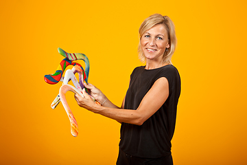 Image showing woman posing with a boomerang