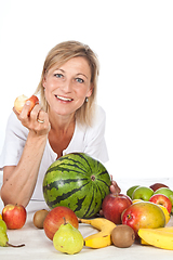 Image showing Blond cute woman eating an apple