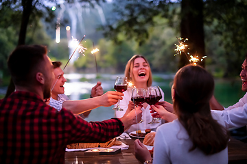 Image showing happy friends having french dinner party outdoor