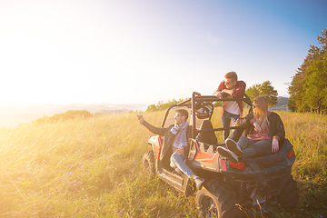 Image showing group of young people driving a off road buggy car