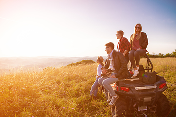 Image showing group of young people driving a off road buggy car