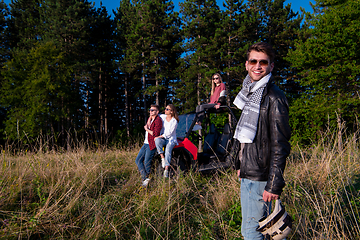 Image showing group of young people driving a off road buggy car