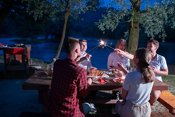 Image showing happy friends having french dinner party outdoor