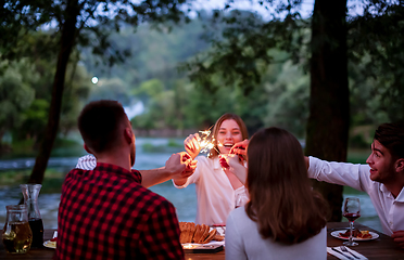 Image showing happy friends having french dinner party outdoor