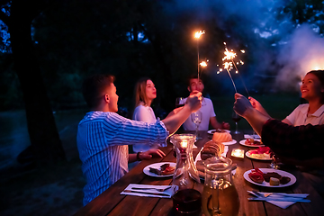 Image showing happy friends having french dinner party outdoor