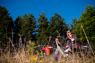 Image showing young couple driving a off road buggy car