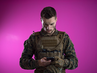 Image showing soldier using smartphone