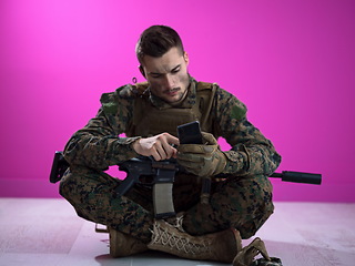 Image showing soldier using smartphone