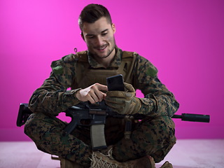 Image showing soldier using smartphone