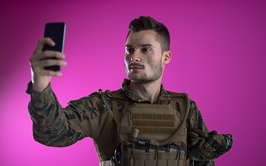 Image showing soldier using smartphone