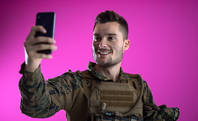 Image showing soldier using smartphone